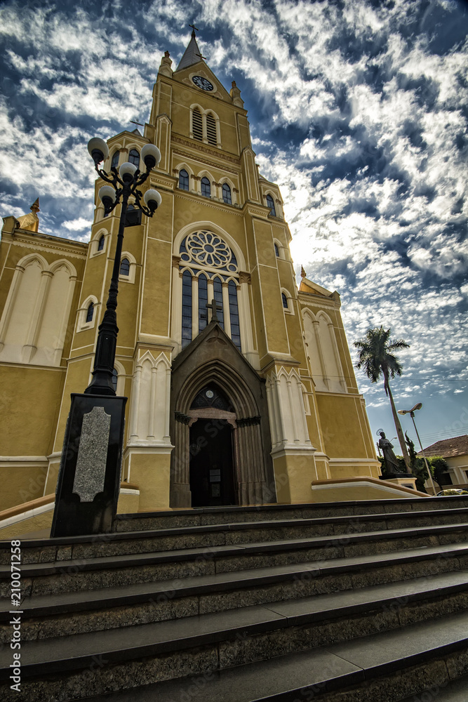 Cathedral church of the city of Santa Rita do Passa Quatro in Sao Paulo - Brazil under blue sky with clouds