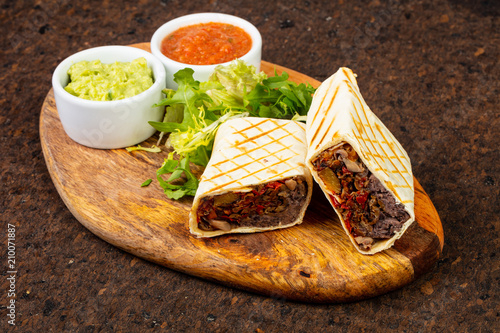 Delicious burito with sauce