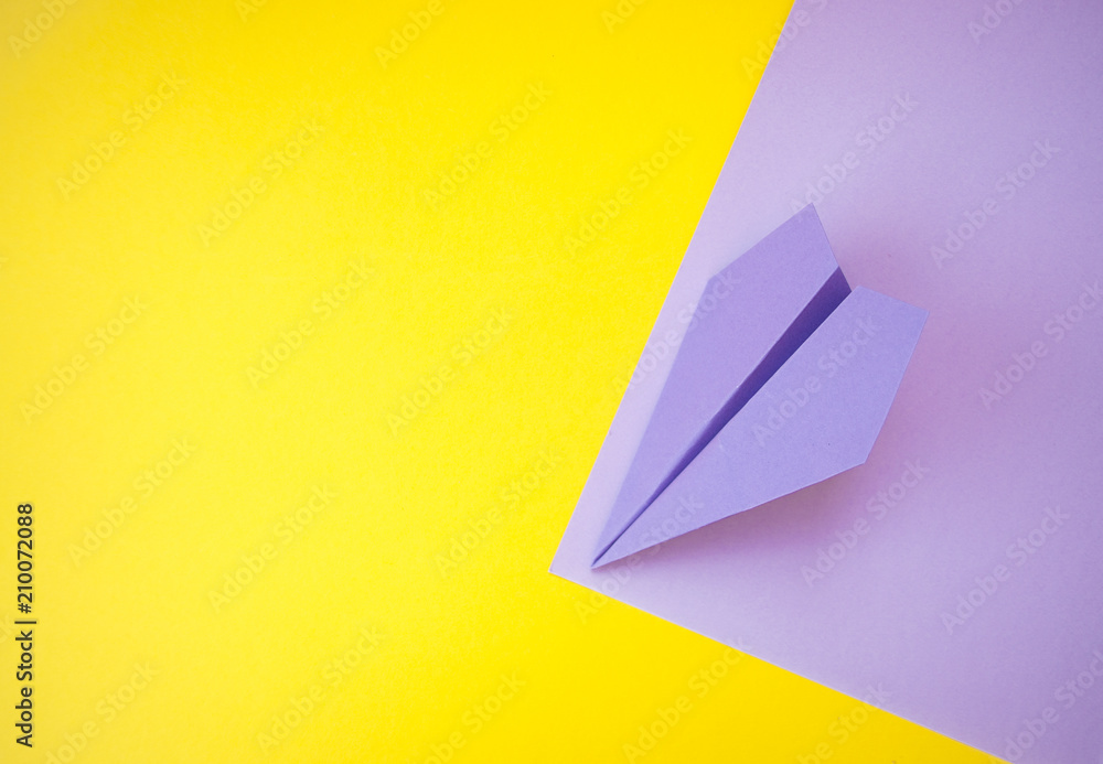 A paper plane on colorful background. A paper plane on colorful background.