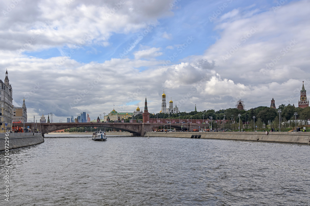 Moscow River. Pleasure boat. View of the Kremlin, Moscow City, Bolshoy Moskvoretsky Bridge.