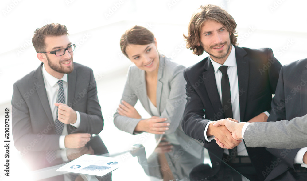 handshake partners at a business meeting handshake partners at a business meeting