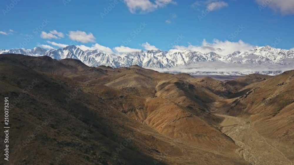 Aerial shot of snow covered mountains in the desert. Aerial shot of snow covered mountains in the desert.