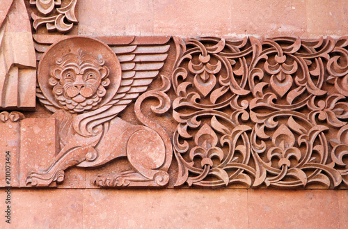 Traditional stone carving ornament on a wall of Armenian Orthodox Church photo