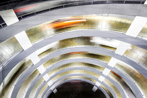 Circular ramp in parking garage Spiral shaped at night