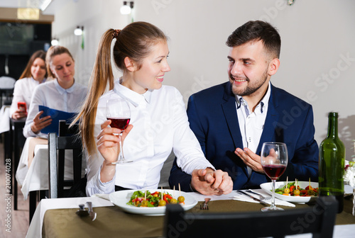 Gentleman with elegant woman are having dinner in luxury restaurante