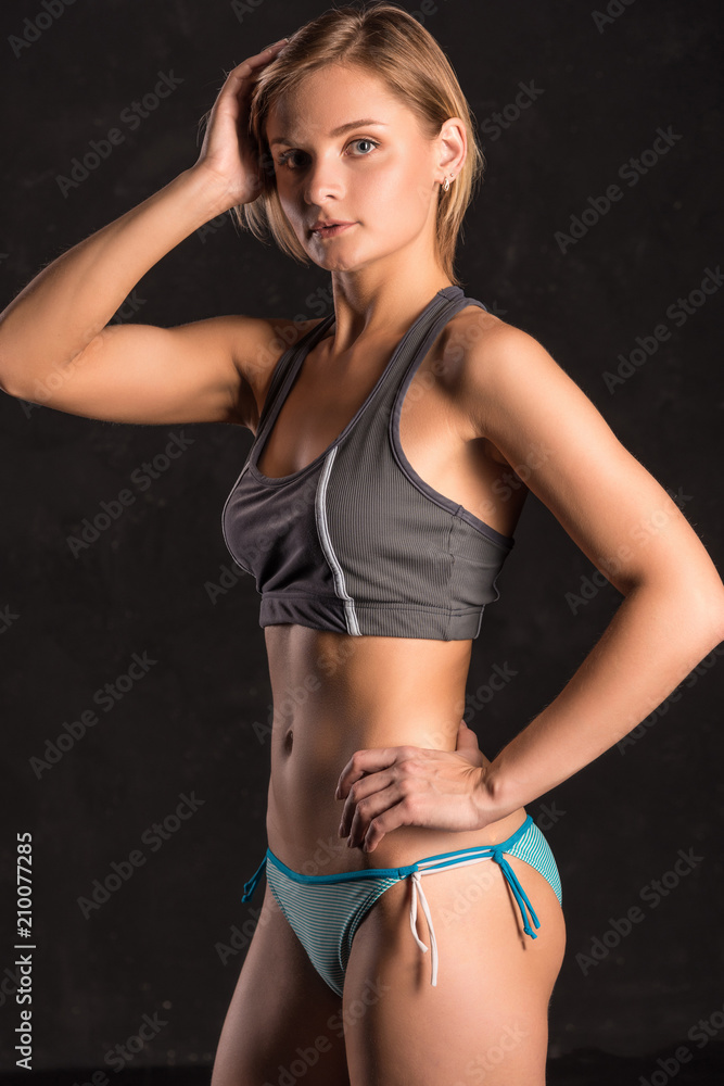 Girl beach volleyball player on a dark background Girl beach volleyball player on a dark background