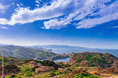 Sea landscape with Cap de Creus, natural park. Eastern point of Spain, Girona province, Catalonia. Famous tourist destination in Costa Brava. Sunny summer day with blue sky and clouds photo