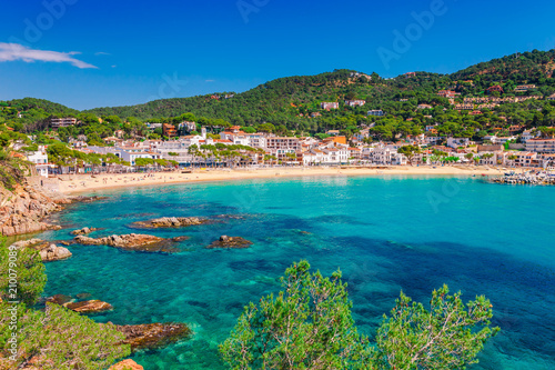 Sea landscape Llafranc near Calella de Palafrugell, Catalonia, Barcelona, Spain. Scenic old town with nice sand beach and clear blue water in bay. Famous tourist destination in Costa Brava photo