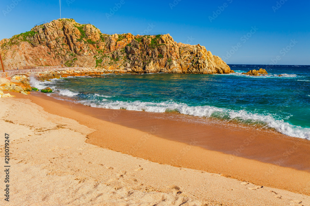 Sea landscape in Blanes, Catalonia, Spain near of Barcelona. Scenic town with nice sand beach and clear blue water in beautiful bay. Famous tourist resort destination in Costa Brava
