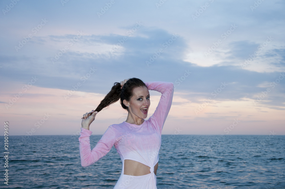 Happy Carefree Woman Enjoying Beautiful Sunset on the Beach. summer Happy Carefree Woman Enjoying Beautiful Sunset on the Beach. summer