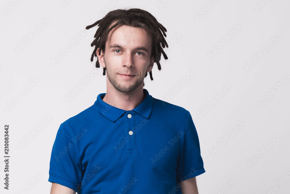 Handsome happy man with dreadlocks in blue t-shirt Handsome happy man with dreadlocks in blue t-shirt