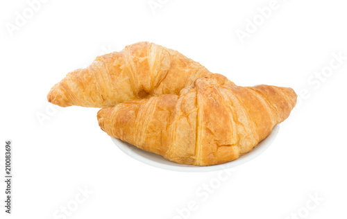 Croissant two pieces in a white dish isolated on a white backgro