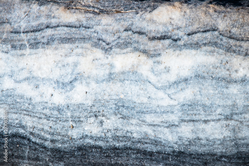 The background is a natural plate Karar marble. The background is a natural plate made of white with blue, yellow and purple veins of Karar marble