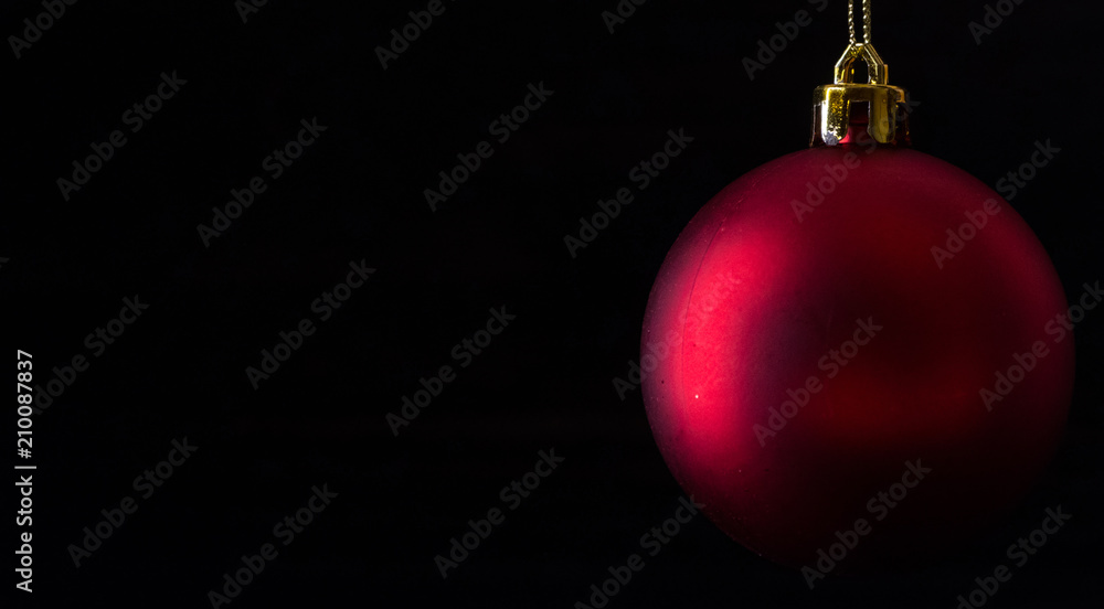 Red christmas balls on wooden board agaisnt dark background Red christmas balls on wooden board agaisnt dark background