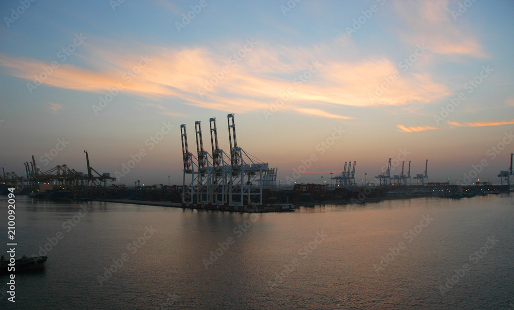 Dawn over a working cargo port.