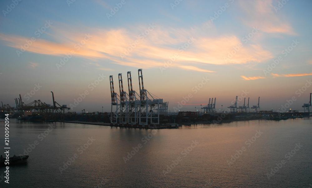 Dawn over a working cargo port. Dawn over a working cargo port.