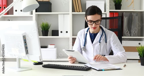 Wallpaper Mural doctor typing text on white tablet in office Torontodigital.ca