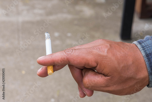 Hand with cigarette.smoking concept.