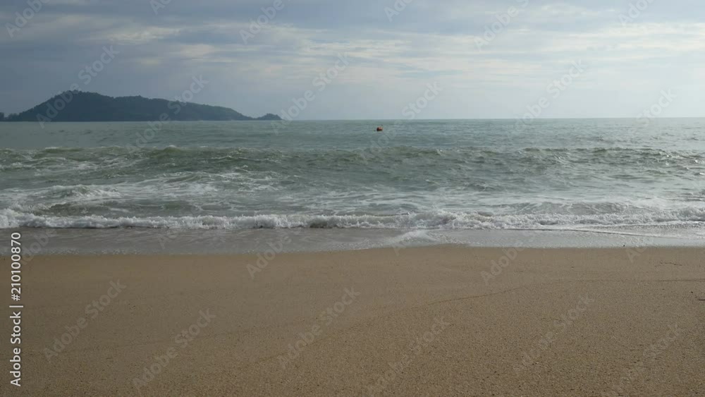 sea wave hit sand beach with horizon skyline and blue evening sky background. sea wave hit sand beach with horizon skyline and blue evening sky background.