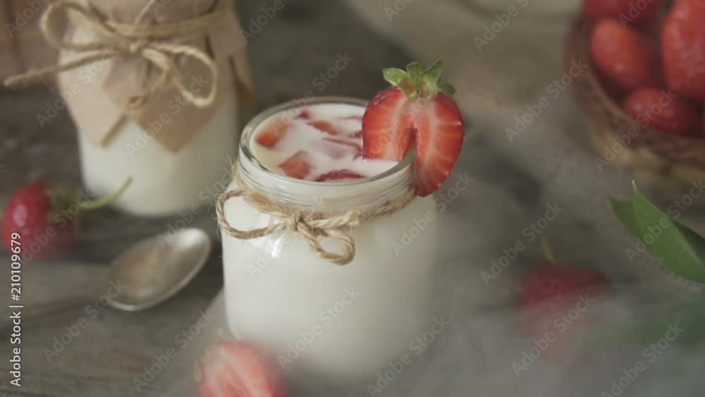Organic yogurt with strawberries in a glass jar. Organic yogurt with strawberries in a glass jar.