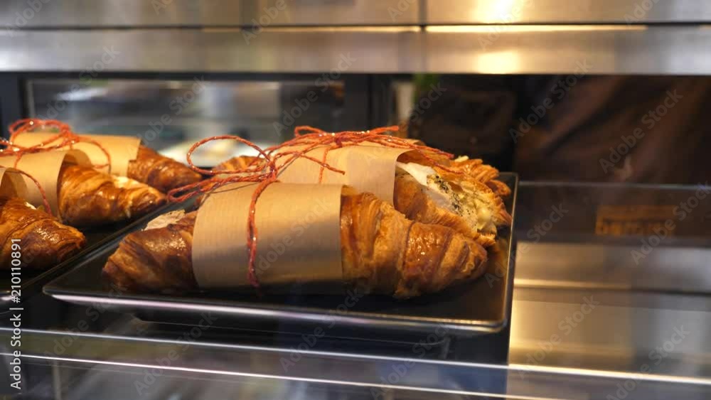 Croissants with a filling on a tray snacks layout in cafe bistro internal showcase at the bar Croissants with a filling on a tray snacks layout in cafe bistro internal showcase at the bar