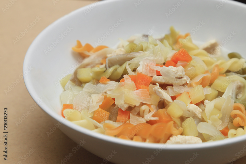 Macaroni soup with chicken, potato, carrot and onion. Macaroni soup with chicken, potato, carrot and onion.