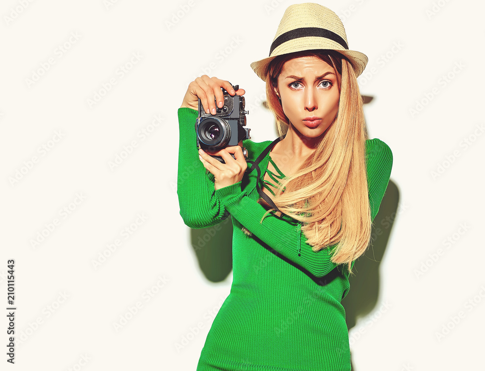 beautiful happy cute blond woman girl in casual summer green hipster clothes takes photos holding retro photographic camera, isolated on a white in hat making a duck face beautiful happy cute blond woman girl in casual summer green hipster clothes takes photos holding retro photographic camera, isolated on a white in hat making a duck face