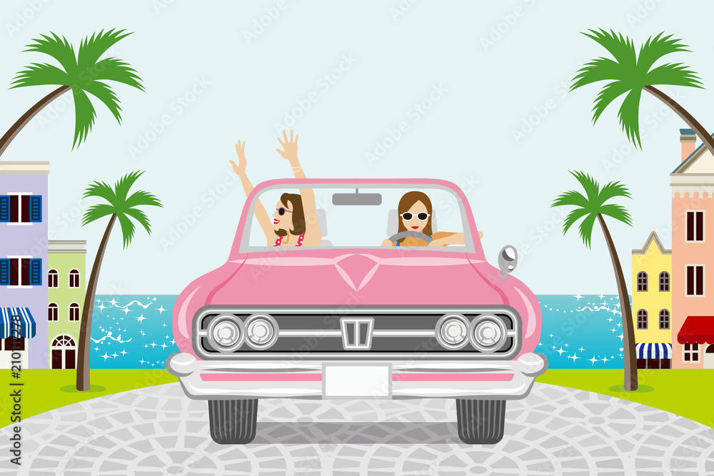 Two women driving a Pink convertible in summer nature - seaside town