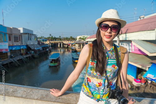 woman looking at camera and lift her sunglasses © PR Image Factory