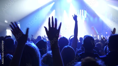 Wallpaper Mural Cheering people clap and jump in flash light spectators crowd silhouettes on a music concert Torontodigital.ca