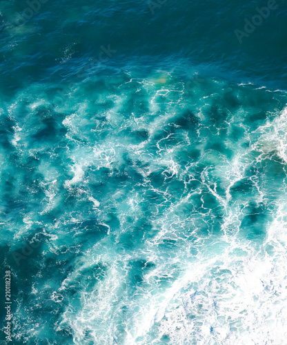 beautiful natural abstract background, turquoise water and waves are broken against a stone. Cabo da Roca, Portugal. The power of the ocean © olezzo