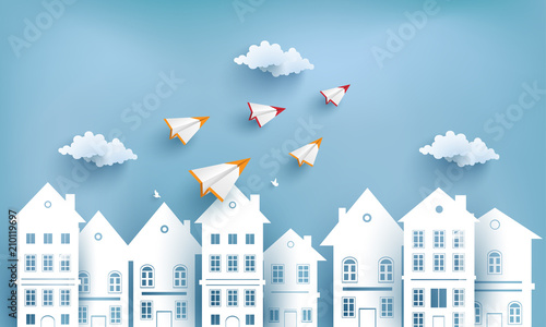 paper airplanes flying across village. design paper art and crafts