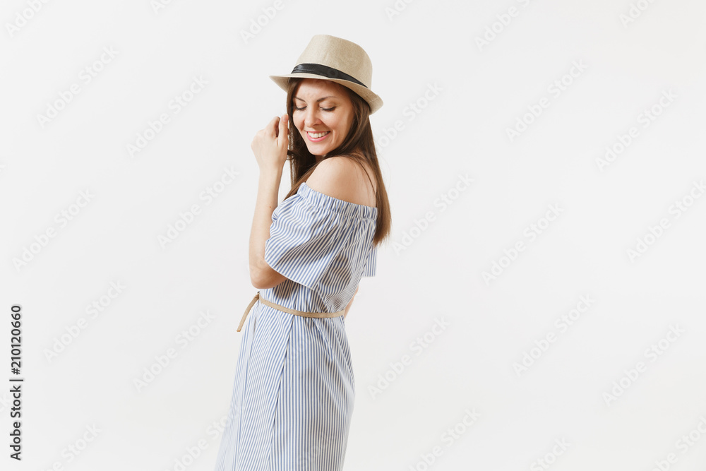 Young tender elegant charming woman dressed blue dress, cute hat with long brunette hair posing isolated on white background. People, sincere emotions, lifestyle concept. Advertising area. Copy space. Young tender elegant charming woman dressed blue dress, cute hat with long brunette hair posing isolated on white background. People, sincere emotions, lifestyle concept. Advertising area. Copy space.