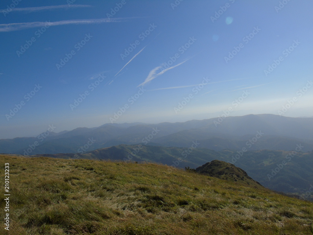 An amazing views to the city of Genova and the sea from the hills over the city with some clouds and foggy An amazing views to the city of Genova and the sea from the hills over the city with some clouds and foggy