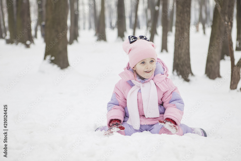 Happy loving caucasian family of mother father and daughter play, having fun in winter snowy park. Cute little girl playing Happy loving caucasian family of mother father and daughter play, having fun in winter snowy park. Cute little girl playing