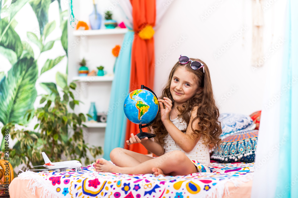 Little Girl with a globe in the arabic interior