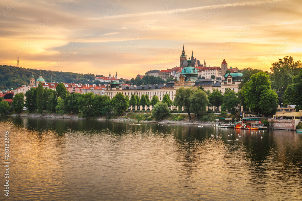 Beautiful golden view of Prague Castle and Vltava river after the sunset, Prague, Czech Republic, Europe