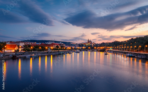 Prague  Czech Republic bridges panorama with historic Prague Castle and Vltava river after the sunset
