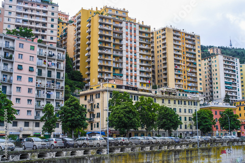 Genoa, Italy - June, 12, 2018: residential district in Genoa on an embankment of river, Italy