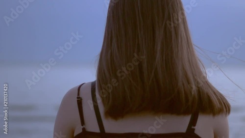 girl meditating by the sea photo