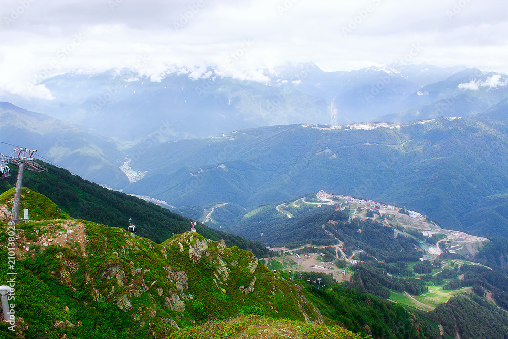 Naklejka premium Landscape haze fog mountains snow tops. Sochi. Russia. Krasnaya Polyana.