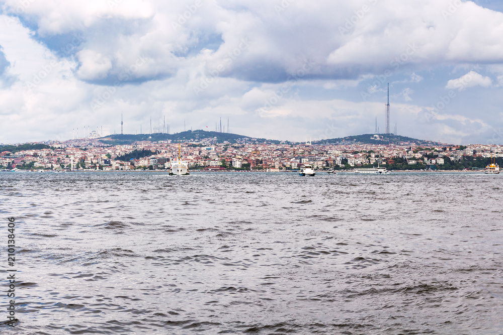 view of Istanbul city on beach of Golden Horn bay