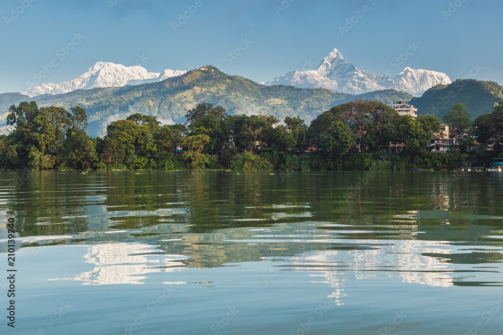 The Machapuchare and Annapurna range seen from Phewa Lake in Pokhara, Nepal 