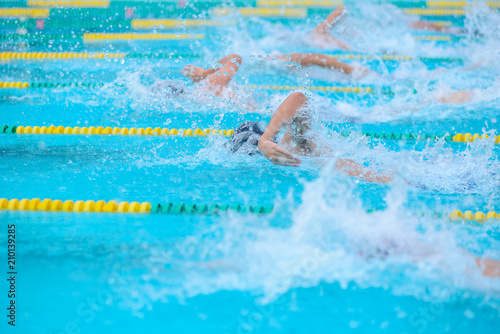 Swimmer swimming competition in the pool is not identifiable