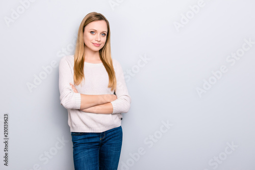 Portrait with copyspace empty place for product of nice gorgeous girl holding arms crossed looking at camera isolated on grey background