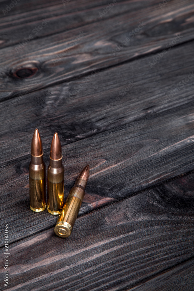 Cartridges on a dark wooden  background