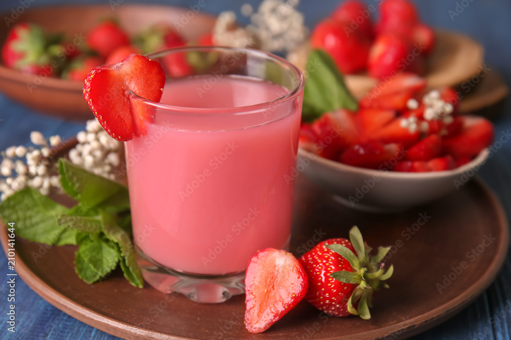 Glass of tasty strawberry starch drink on table Glass of tasty strawberry starch drink on table