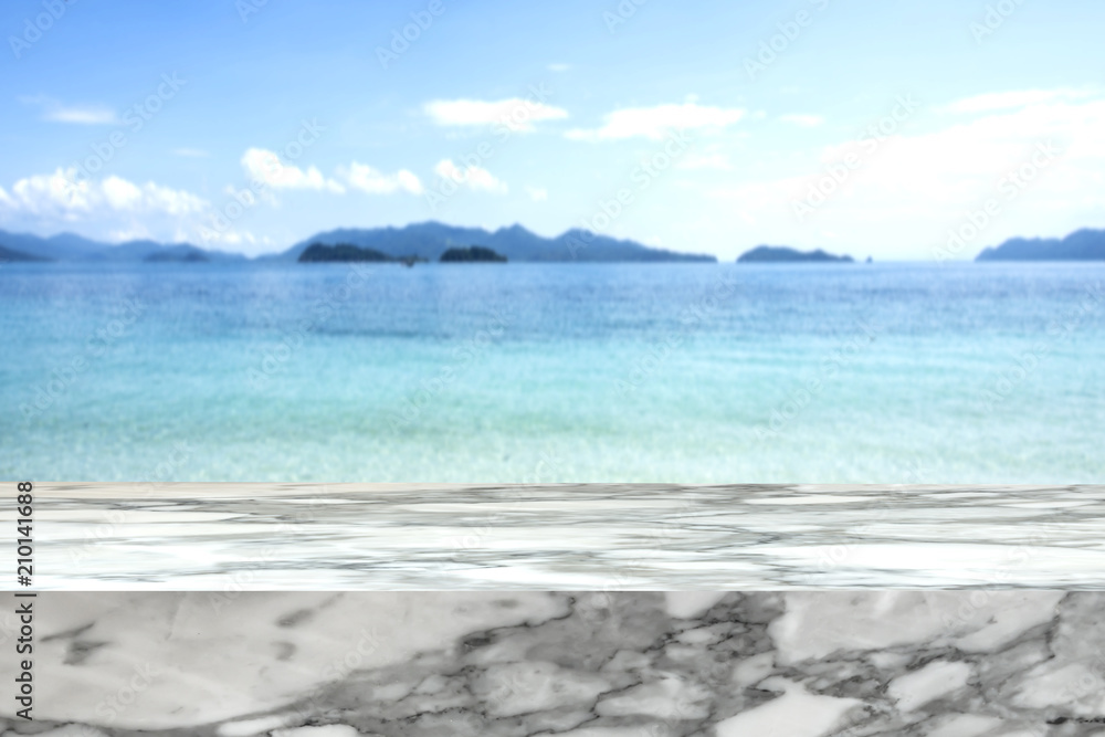 Marble stone mock up template over blurred tropical blue sea for  interior or exterior decoration background or advertising design 