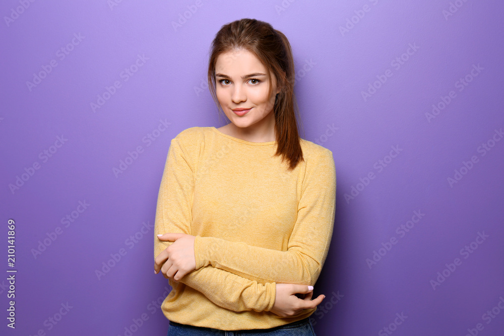 Obraz premium Beautiful young woman on color background