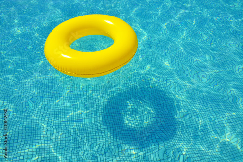 Colorful inflatable tube floating in swimming poo